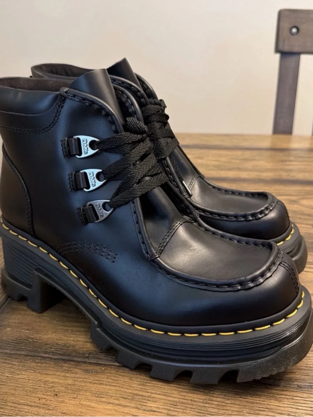 Dr. Martens Black Leather Lug-Sole Ankle Boots with Yellow Stitching